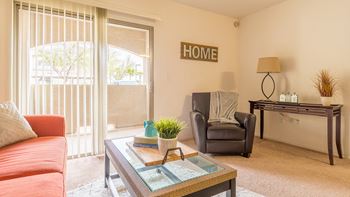 Desert Sands living room with private balcony. 